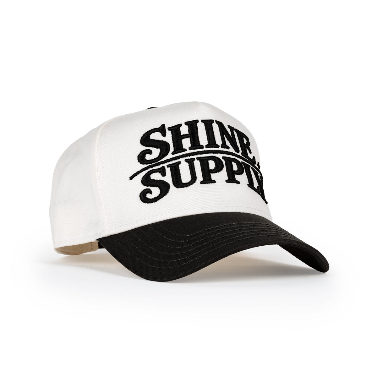 Daily Driver snapback in cream with charcoal bill, embroidered bold Shine Supply logo
