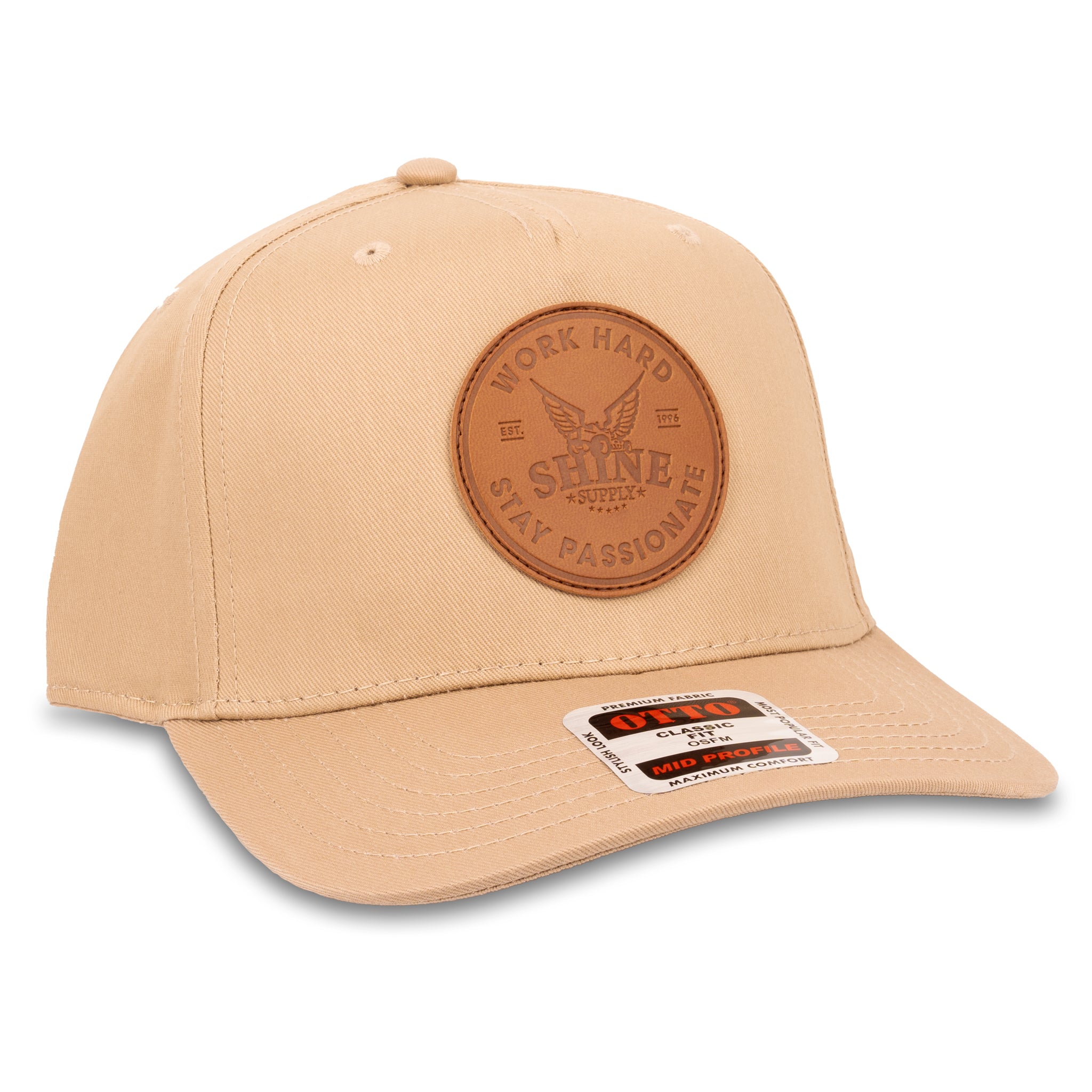 Tan Otto snapback hat featuring a leather patch with 'Work Hard Shine Supply Stay Passionate' embossed.